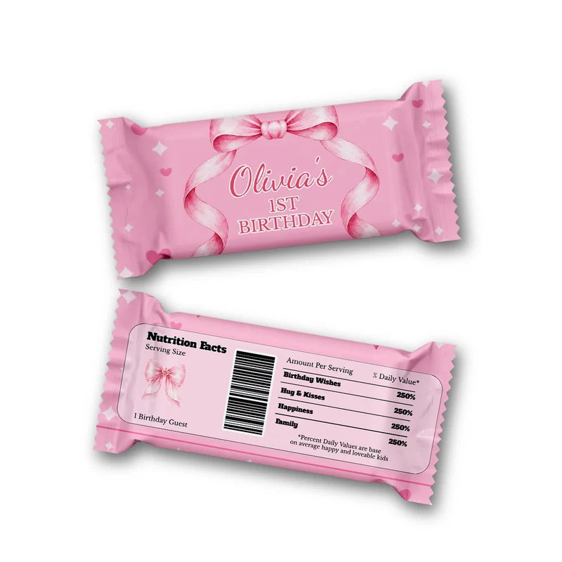 Pink Bow Rice Krispies treats and candy bar labels shown together in a charming party snack display