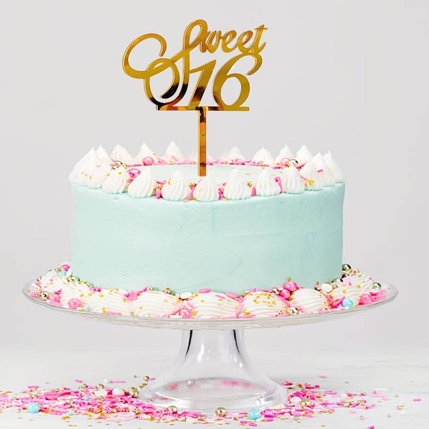 Gold acrylic cake topper with the text 'sweet 16' perfect for 16th birthday celebrations.