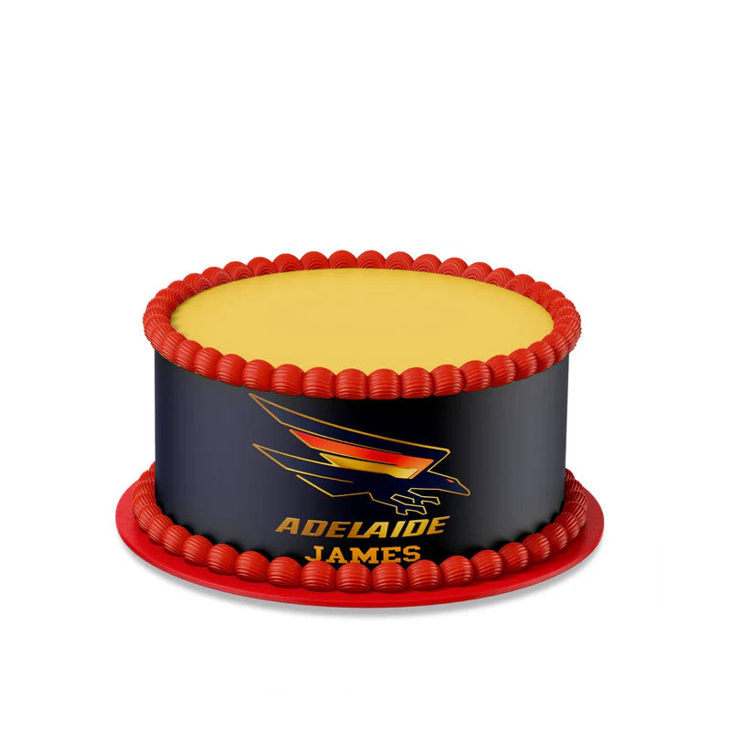 Adelaide Crows edible cake strips with red and navy graphics wrapped around rectangular cake