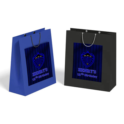 Auckland FC goodie bag label with bold green blue football design on white paper bag