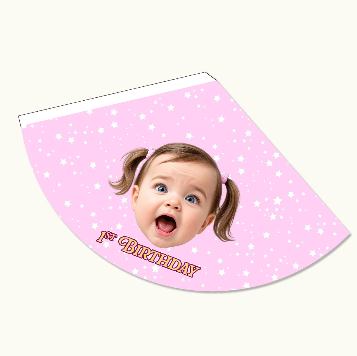 Close-up of a personalised baby pink children's party hat showing high-quality cardstock text and face photo layout.