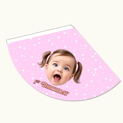 Close-up of a personalised baby pink children's party hat showing high-quality cardstock text and face photo layout.