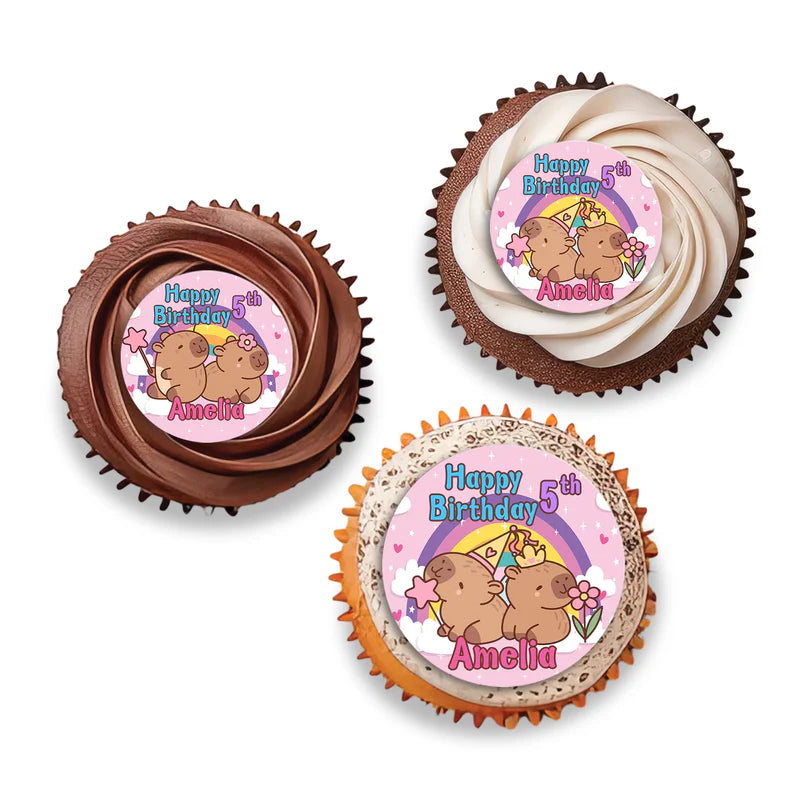 Capybara personalized cupcake toppers shown as small round themed decorations on wooden sticks flat lay