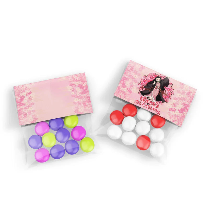 Demon Slayer Nezuko treat bag topper label folded over a clear plastic favor bag filled with pink candies
