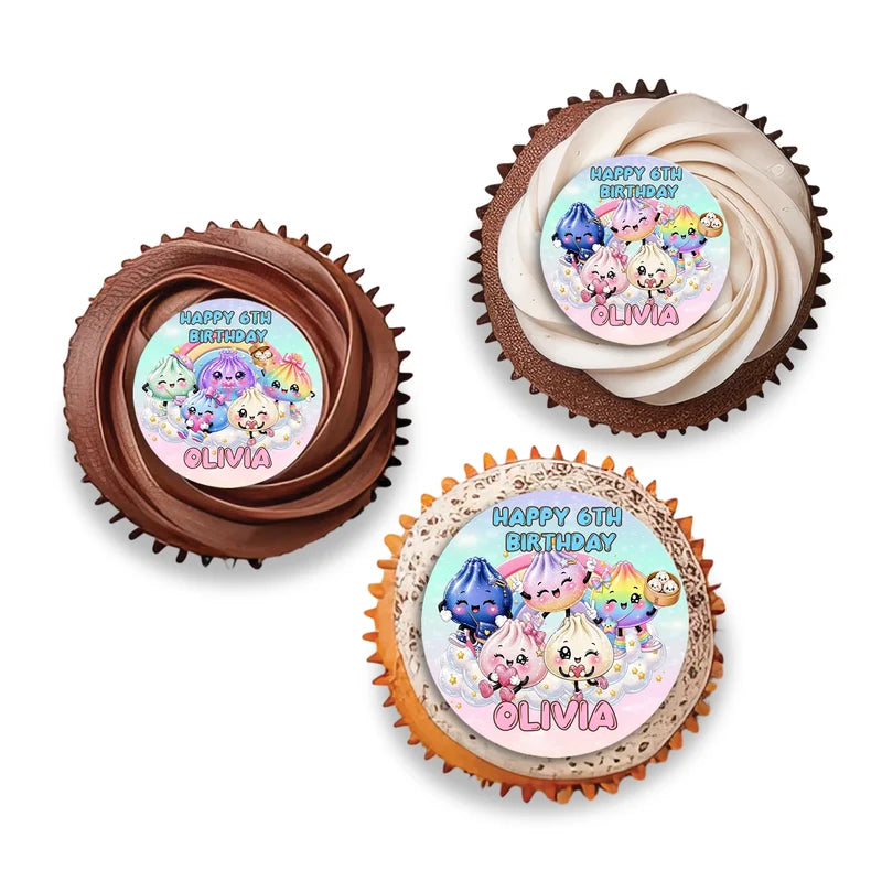 Glitter Dumpling personalized cupcake toppers arranged neatly on frosted treats against a neutral backdrop