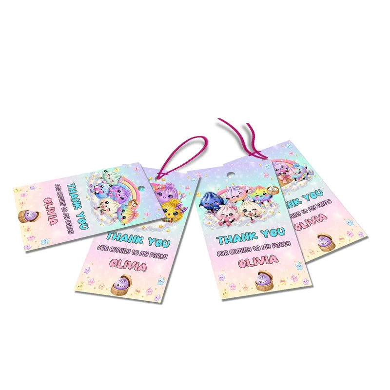 Glitter Dumpling thank you tags with colorful text accents displayed on a neatly wrapped party favor box