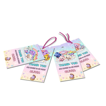 Glitter Dumpling thank you tags with colorful text accents displayed on a neatly wrapped party favor box