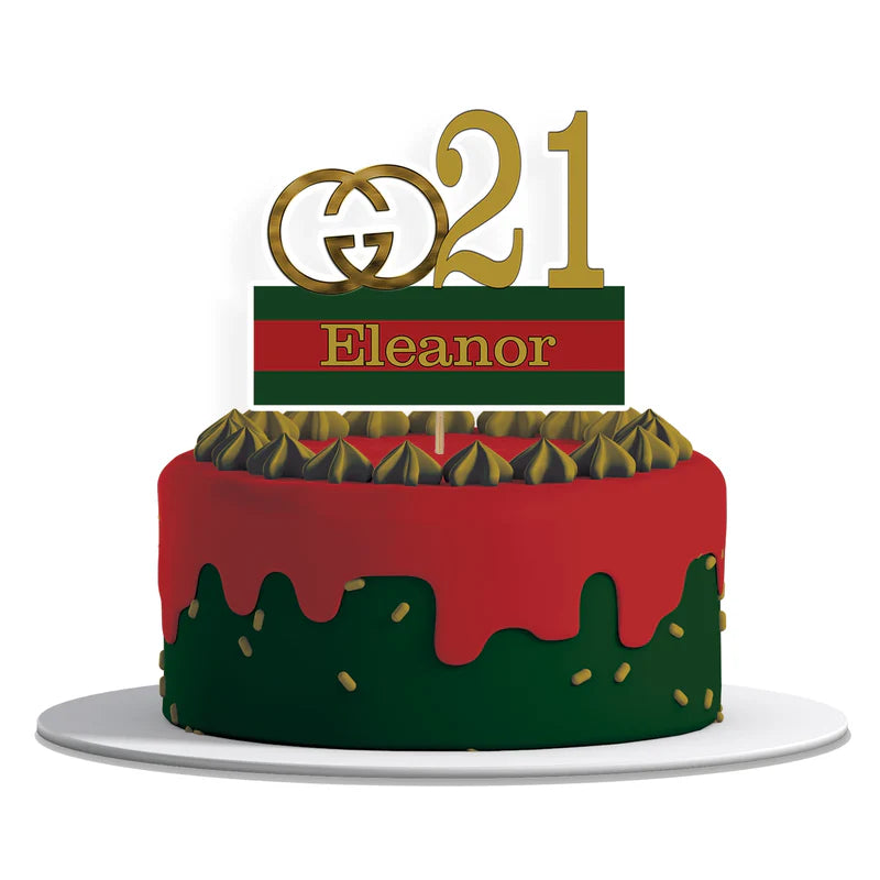 Gucci inspired personalized cake toppers in gold and green red stripe design flat lay on table