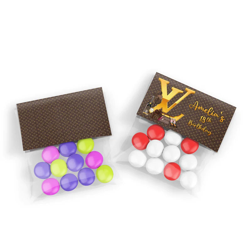 Louis Vuitton inspired treat bag topper label with folded monogram design on clear treat bag