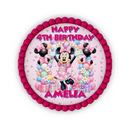 Minnie Mouse edible icing cake images with colorful character illustrations placed on a frosted round cake