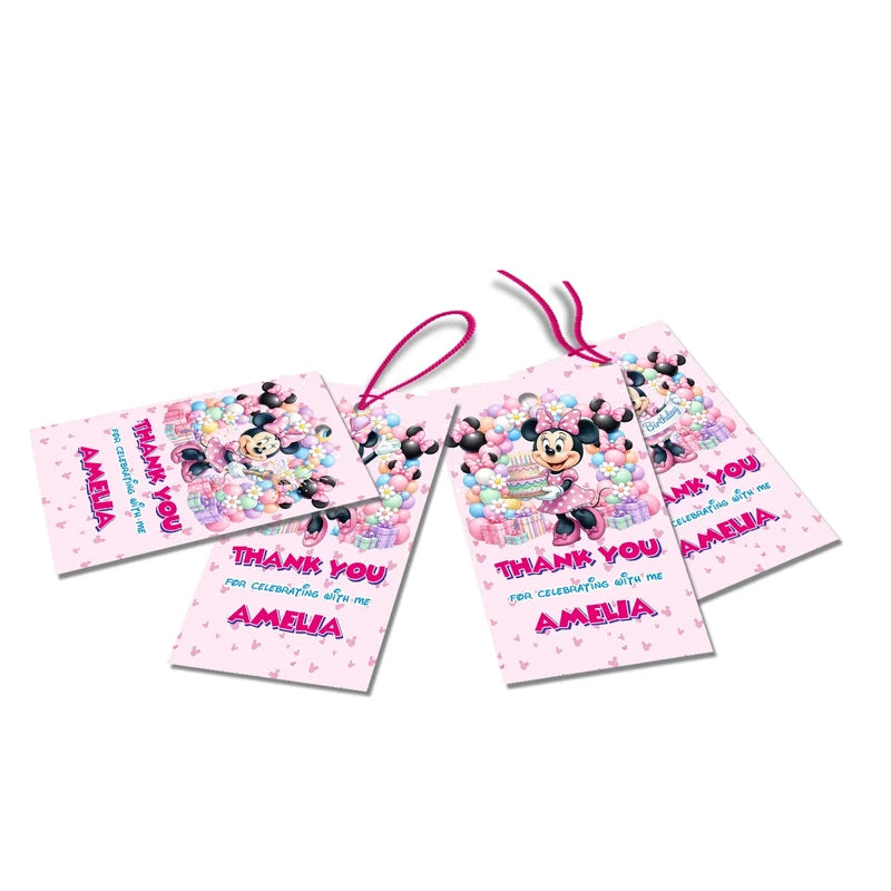 Minnie Mouse thank you tags with colorful text accents displayed on a neatly wrapped party favor box