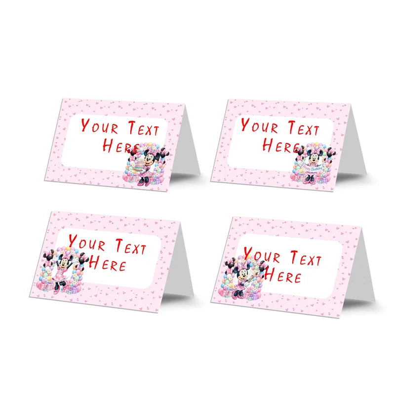 Minnie Mouse food cards showing a collection of vibrant buffet labels arranged on a decorated treat t