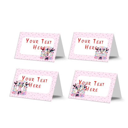 Minnie Mouse food cards showing a collection of vibrant buffet labels arranged on a decorated treat t