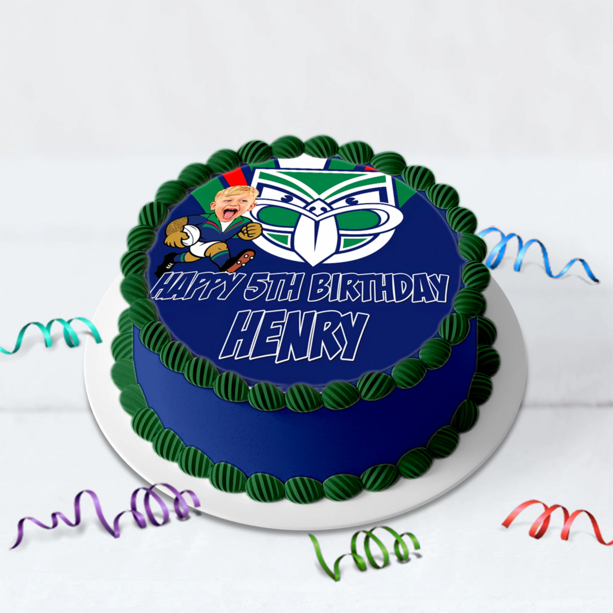 Personalized NZ Warriors birthday cake with custom face photo caricature icing topper showing age and name.