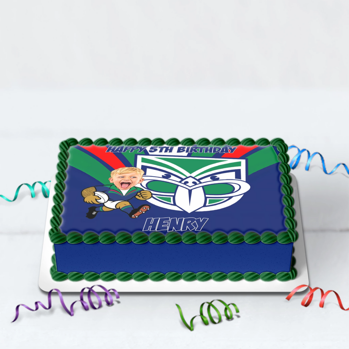 Custom NZ Warriors cake topper featuring personalized caricature face, name, and age printed on edible icing sheet.