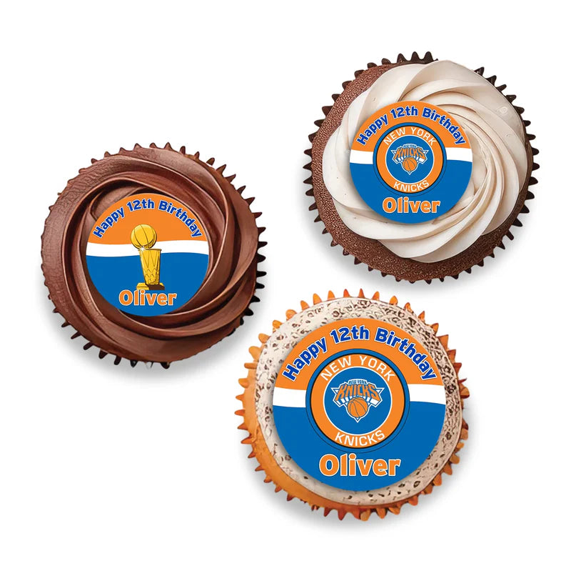 New York Knicks cupcake toppers with orange and blue basketball theme placed on frosted cupcakes