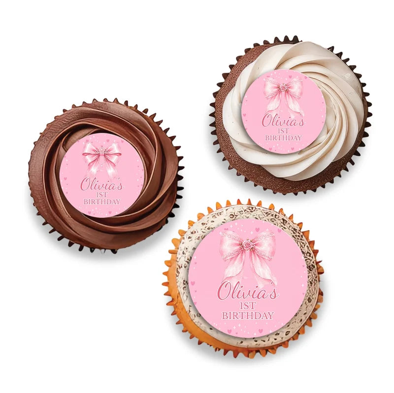 Pink Bow personalized cupcake toppers arranged neatly on frosted treats against a neutral backdrop