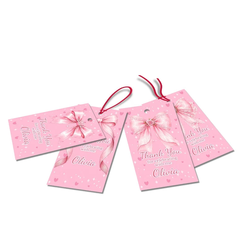 Pink Bow thank you tags with elegant script text accents displayed on a neatly wrapped party favor box