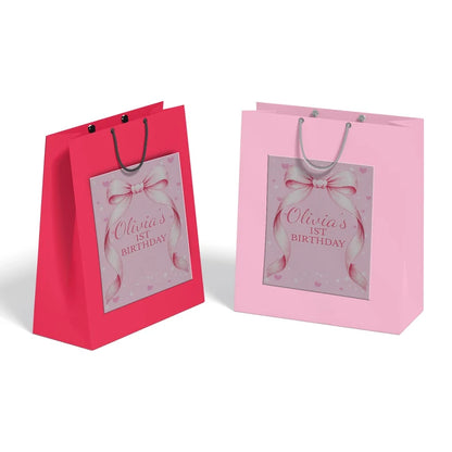 Pink Bow goodie bag label featuring a charming party theme design applied to a classic paper gift bag