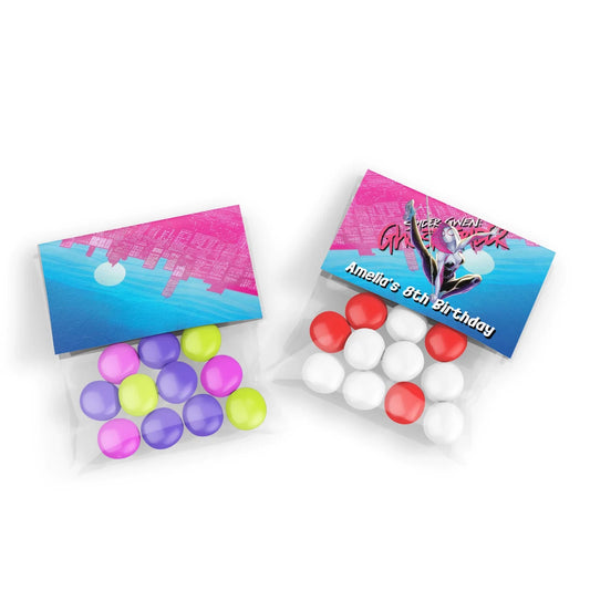 Spider-Woman treat bag topper label with web design in red, blue, and black on white background