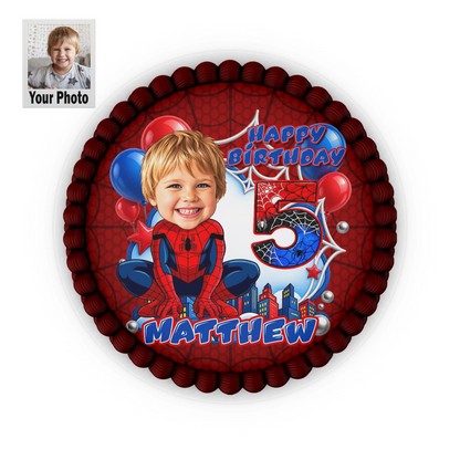 Printed edible icing cake topper sheet with a Spider-Man theme, featuring a customized kid's face drawn in a cartoon caricature style with custom name and age.