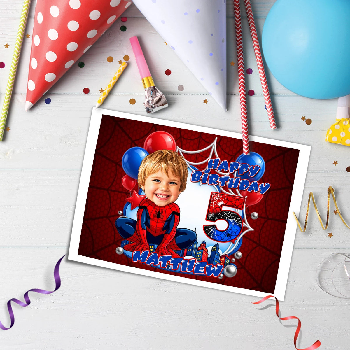 Printed edible icing cake topper sheet with a Spider-Man theme, featuring a customized kid's face drawn in a cartoon caricature style with custom name and age.