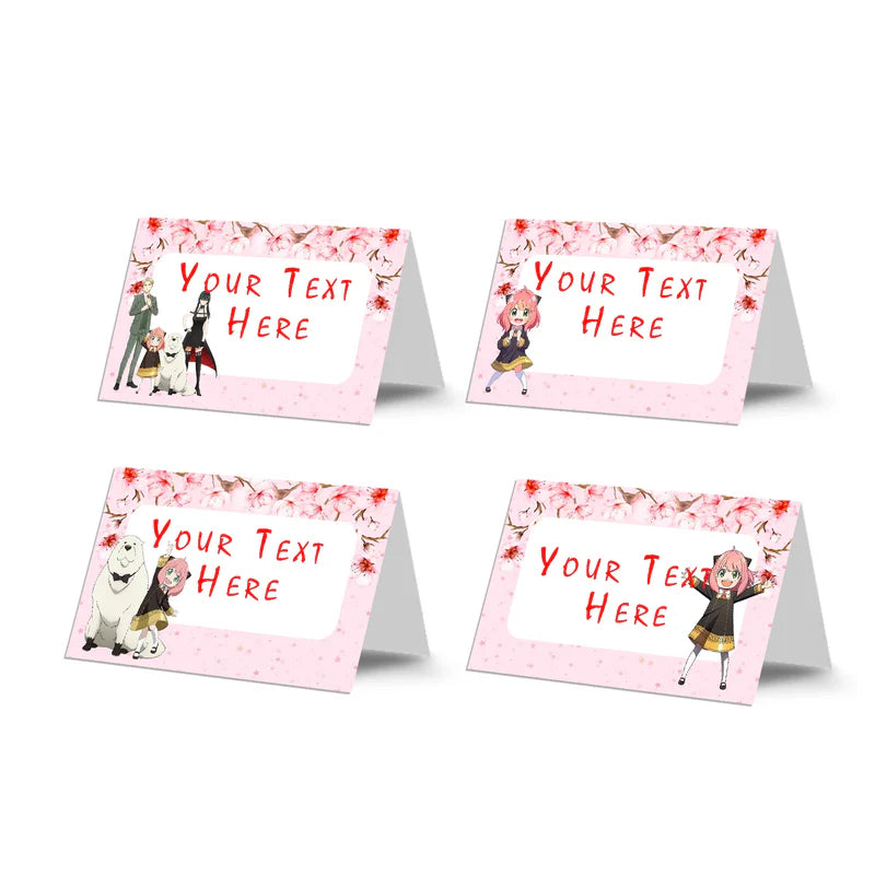 Spy X Family food cards featuring custom text on folded pink and black themed buffet tent labels flat lay