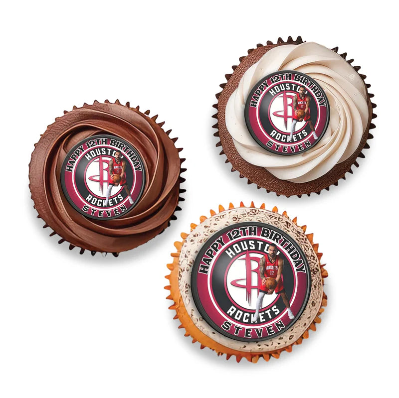 Steven Adams cupcake toppers with circular team design on toothpicks, placed in yellow and white frosted cupcakes