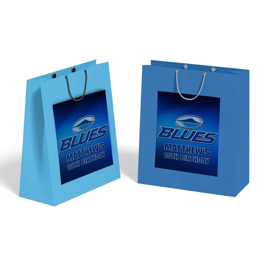 The Blues Rugby goodie bag label displayed as a paper fold-over header card attached to a clear plastic treat pouch.
