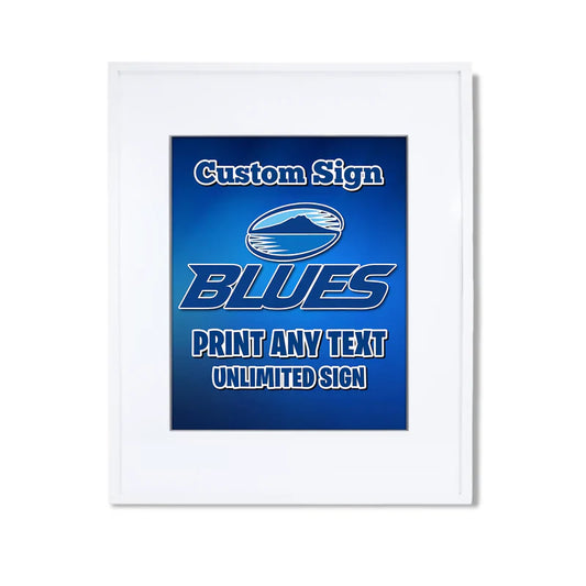 The Blues Rugby custom sign displaying a rectangular board with bold team typography on a dark wood table easel mockup.