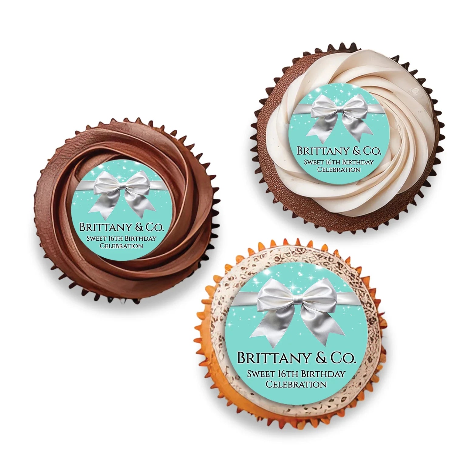 Tiffany & CO cupcake toppers with small white bows and teal blue circular frames displayed in a flat lay arrangement